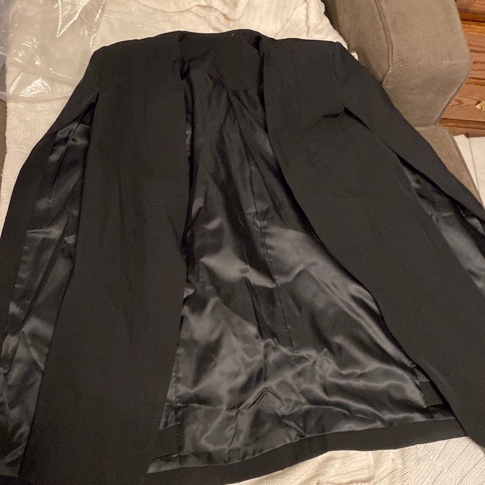 Cape style blazer.
